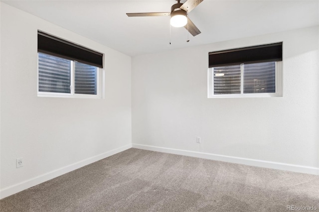 spare room with carpet and ceiling fan