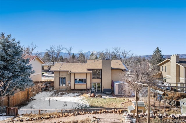 back of house featuring a mountain view