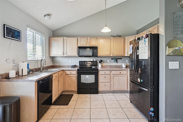 kitchen featuring light brown cabinets, hanging light fixtures, vaulted ceiling, and black appliances