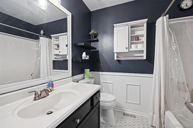 full bathroom with vanity, tile patterned flooring, toilet, and shower / tub combo with curtain