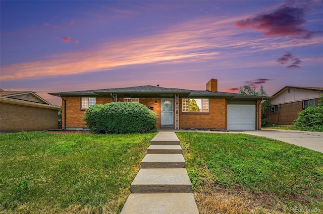 2280 Sherrelwood Dr, Denver, CO 80221 - ranch-style home with a garage, concrete driveway, a front lawn, and brick siding