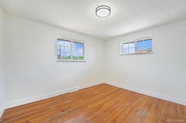 2280 Sherrelwood Dr, Denver, CO 80221 - empty room featuring baseboards and light wood-style flooring