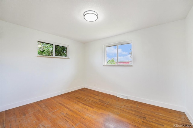 2280 Sherrelwood Dr, Denver, CO 80221 - spare room with plenty of natural light, baseboards, and wood finished floors