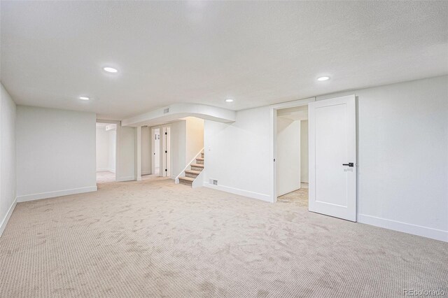 2280 Sherrelwood Dr, Denver, CO 80221 - finished below grade area featuring recessed lighting, baseboards, stairway, and light colored carpet