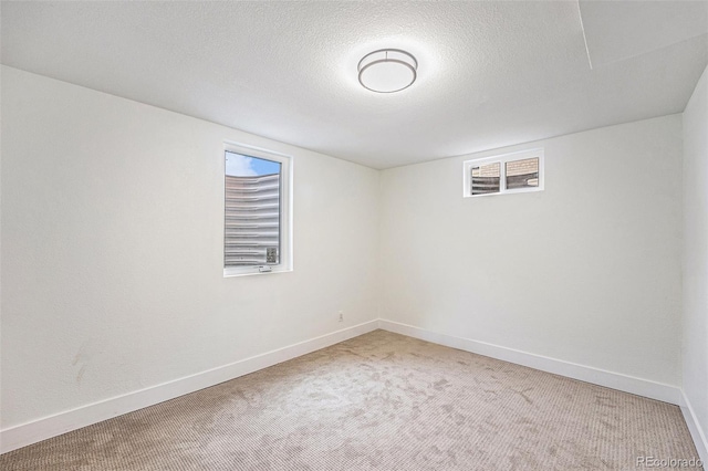2280 Sherrelwood Dr, Denver, CO 80221 - below grade area featuring carpet flooring, baseboards, and a textured ceiling