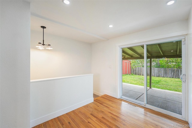 2280 Sherrelwood Dr, Denver, CO 80221 - spare room featuring baseboards, a chandelier, light wood finished floors, and recessed lighting