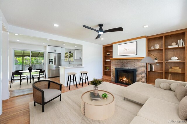 2280 Sherrelwood Dr, Denver, CO 80221 - living area with a ceiling fan, light wood-style flooring, recessed lighting, and a fireplace