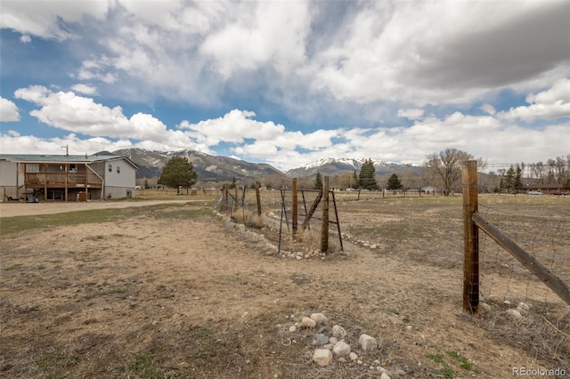 15980 County Road 306, Buena Vista, CO 81211 - view of yard with fence, a deck with mountain view, and a rural view
