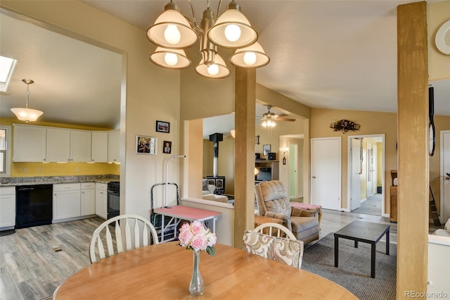 15980 County Road 306, Buena Vista, CO 81211 - dining room featuring ceiling fan, a wood stove, light wood-style flooring, and lofted ceiling