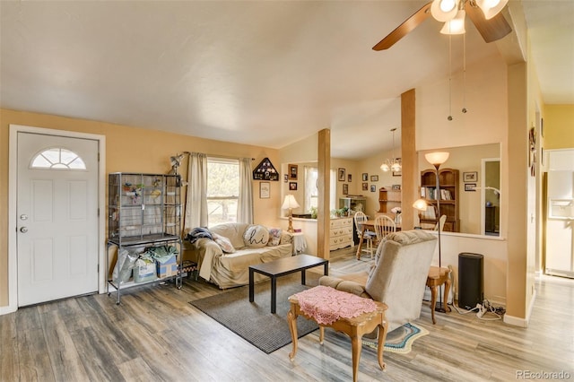 15980 County Road 306, Buena Vista, CO 81211 - living room featuring baseboards, ceiling fan with notable chandelier, wood finished floors, and lofted ceiling