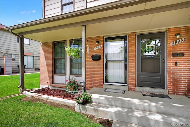 3947 W Ohio Ave, Denver, CO 80219 - entrance to property with brick siding and a porch