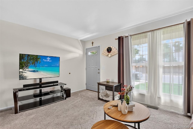 3947 W Ohio Ave, Denver, CO 80219 - carpeted living room featuring healthy amount of natural light