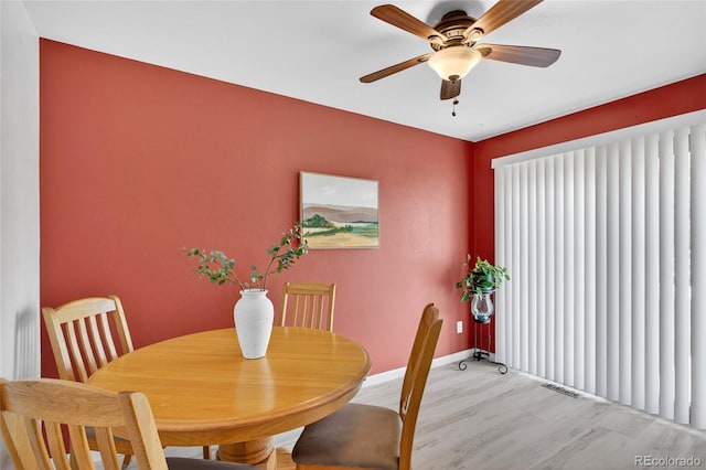 3947 W Ohio Ave, Denver, CO 80219 - dining space with light wood-style flooring and a ceiling fan