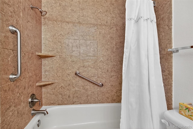 3947 W Ohio Ave, Denver, CO 80219 - bathroom featuring shower / bath combo with shower curtain and toilet