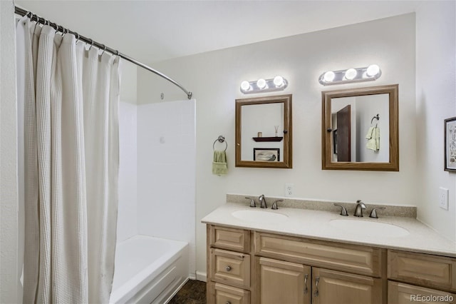 bathroom featuring double sink vanity and shower / tub combo with curtain