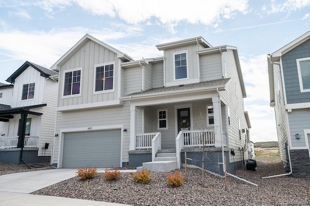 695 Simmental Loop, Castle Rock, CO 80104 - view of front of home featuring a porch, board and batten siding, an attached garage, and concrete driveway