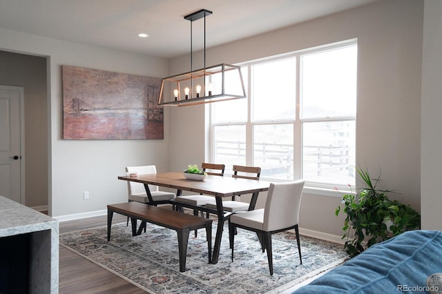 695 Simmental Loop, Castle Rock, CO 80104 - dining area featuring baseboards, dark wood-style flooring, a chandelier, and recessed lighting