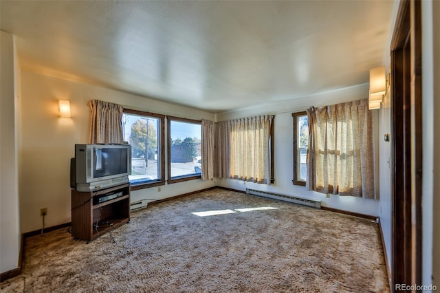 interior space with carpet floors, a baseboard radiator, and baseboards