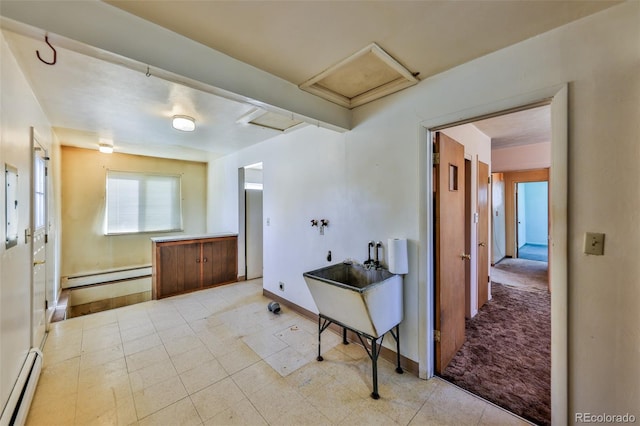 bathroom with a baseboard radiator