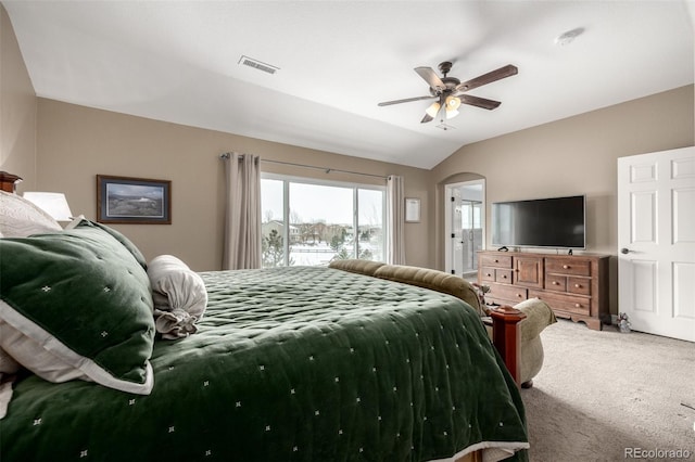 carpeted bedroom featuring access to exterior, arched walkways, visible vents, vaulted ceiling, and ceiling fan