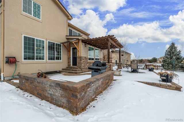 exterior space with a grill and a pergola