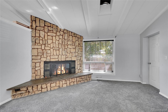 unfurnished living room featuring a stone fireplace, carpet floors, and vaulted ceiling with beams