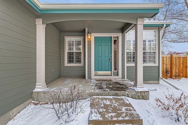 view of snow covered property entrance