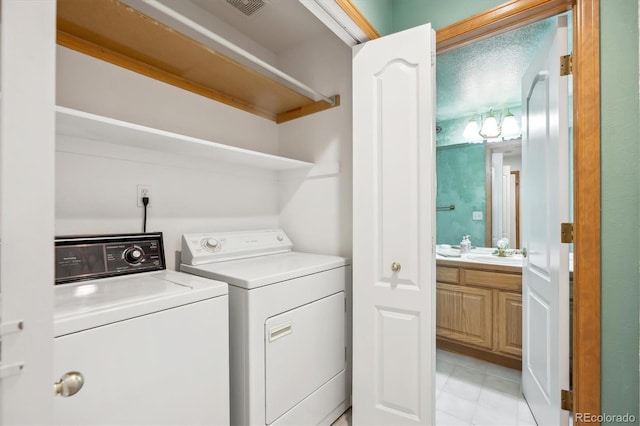 248 Summit Trl, Broomfield, CO 80020 - clothes washing area featuring laundry area, a sink, light tile patterned floors, visible vents, and washer and clothes dryer
