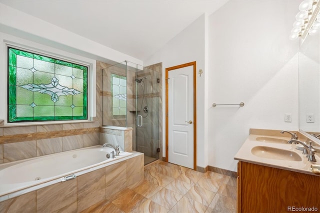 248 Summit Trl, Broomfield, CO 80020 - bathroom with double vanity, a jetted tub, baseboards, a shower stall, and lofted ceiling