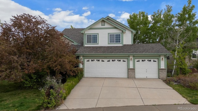 248 Summit Trl, Broomfield, CO 80020 - traditional-style house with brick siding, a shingled roof, and concrete driveway