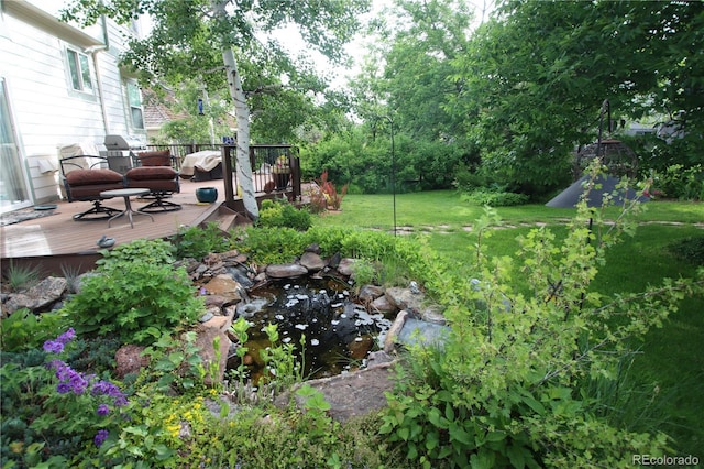 248 Summit Trl, Broomfield, CO 80020 - view of yard featuring a deck and a garden pond