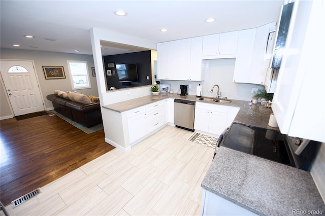 3111 W Bails Pl, Denver, CO 80219 - kitchen featuring dishwasher, range with electric cooktop, white cabinets, recessed lighting, and open floor plan