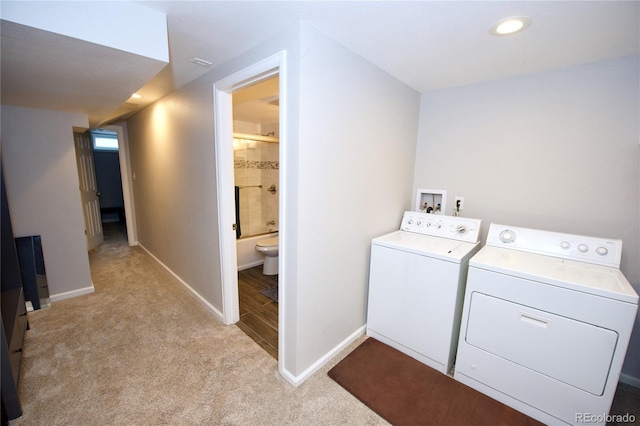 3111 W Bails Pl, Denver, CO 80219 - washroom with washer and clothes dryer and light colored carpet