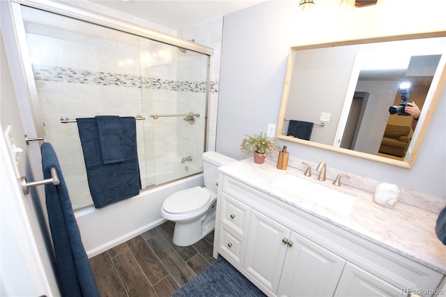 3111 W Bails Pl, Denver, CO 80219 - bathroom with vanity, wood finished floors, and enclosed tub / shower combo