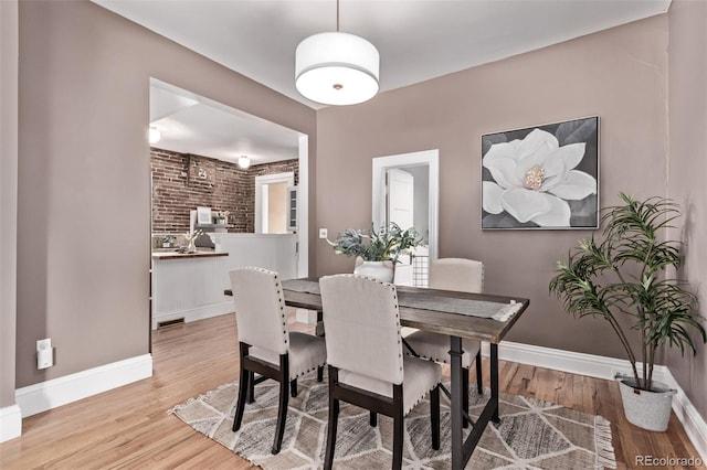 368 S Humboldt St, Denver, CO 80209 - dining room featuring wood finished floors and baseboards