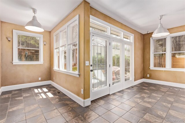 368 S Humboldt St, Denver, CO 80209 - doorway to outside with baseboards and dark stone finish flooring