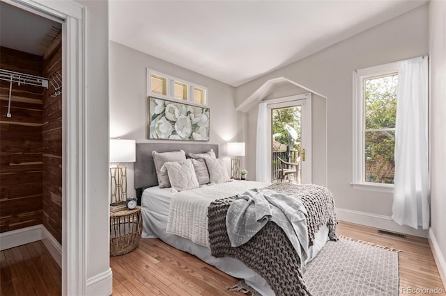 368 S Humboldt St, Denver, CO 80209 - bedroom with access to exterior, baseboards, and light wood-style floors
