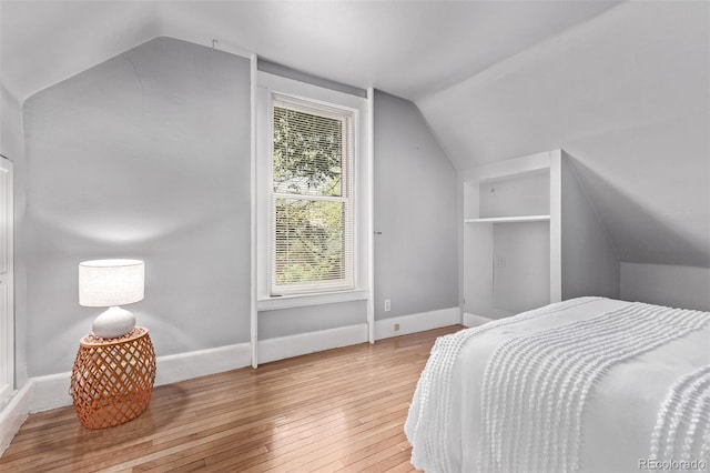 368 S Humboldt St, Denver, CO 80209 - bedroom with vaulted ceiling, hardwood / wood-style floors, and baseboards