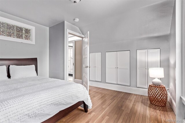 368 S Humboldt St, Denver, CO 80209 - bedroom with hardwood / wood-style flooring, baseboards, and lofted ceiling
