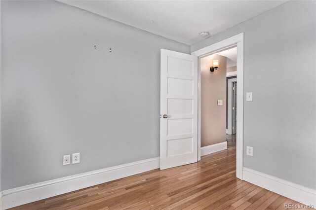 368 S Humboldt St, Denver, CO 80209 - spare room with wood-type flooring, baseboards, and a smoke detector