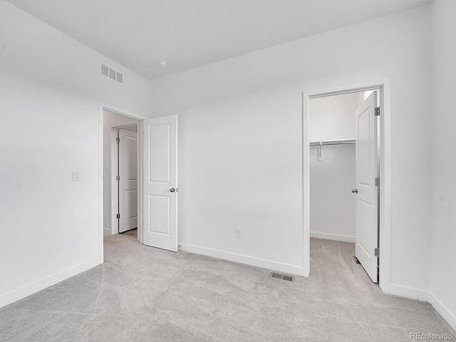 2059 S Vance Way, Denver, CO 80227 - unfurnished bedroom featuring carpet flooring, baseboards, a spacious closet, and a closet