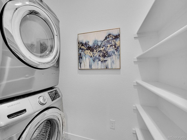2059 S Vance Way, Denver, CO 80227 - laundry room with stacked washer / drying machine and baseboards