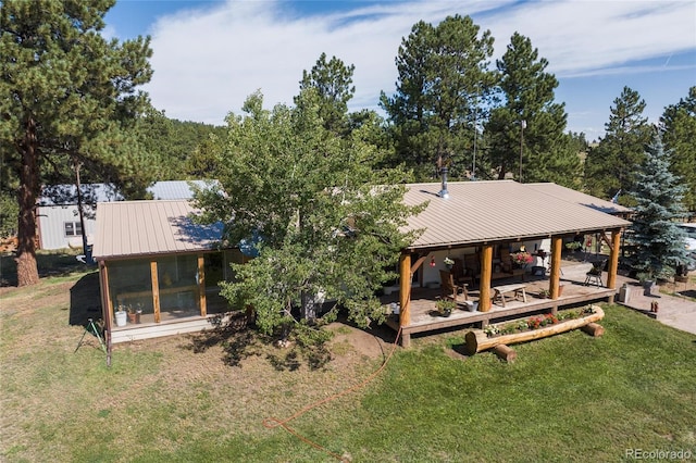 10000 State Highway 96, Westcliffe, CO 81252 - back of property featuring a metal roof, a sunroom, and a yard