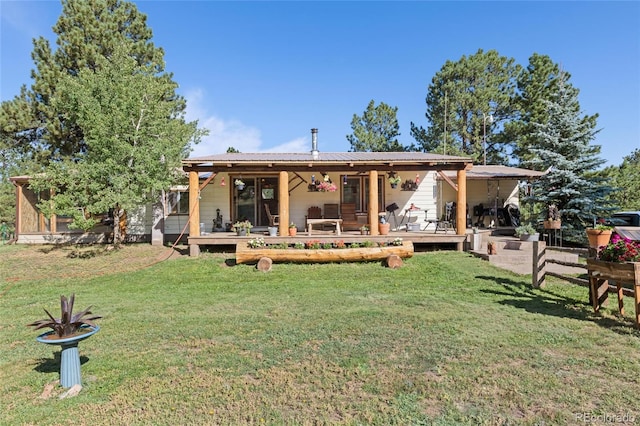 rear view of house with a yard