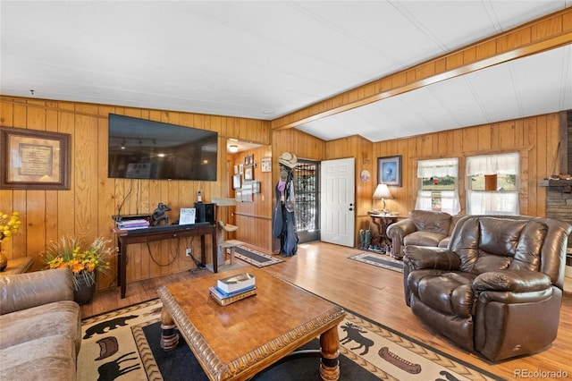 living room featuring hardwood / wood-style floors and vaulted ceiling