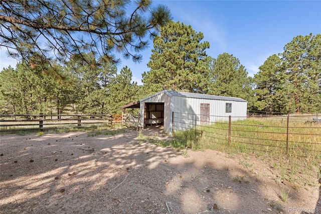 view of outbuilding featuring a rural view