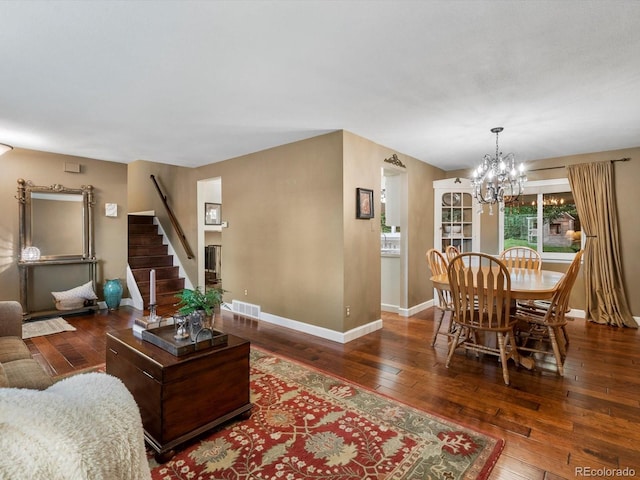 13762 W 67th Pl, Arvada, CO 80004 - living room with hardwood / wood-style flooring, a chandelier, and stairs