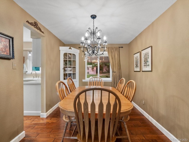 13762 W 67th Pl, Arvada, CO 80004 - dining space featuring wood-type flooring and a chandelier