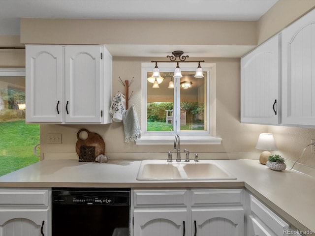 13762 W 67th Pl, Arvada, CO 80004 - kitchen featuring black dishwasher, white cabinetry, and light countertops