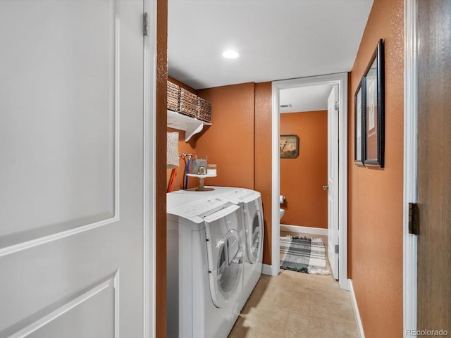 13762 W 67th Pl, Arvada, CO 80004 - laundry room featuring light tile patterned flooring and washing machine and clothes dryer